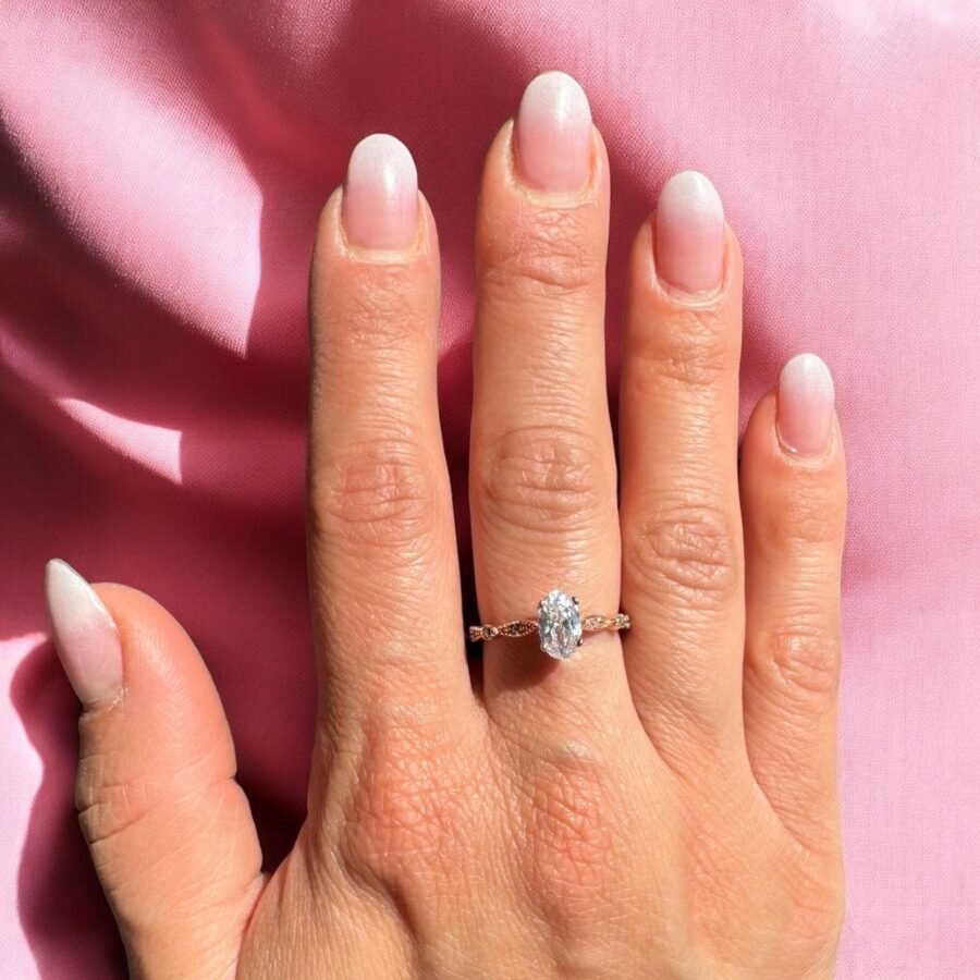 Oval ring set with natural diamonds,( E Color VVS2 Clarity) 0.93 center engagement ring, 14 carat. side diamond setting.